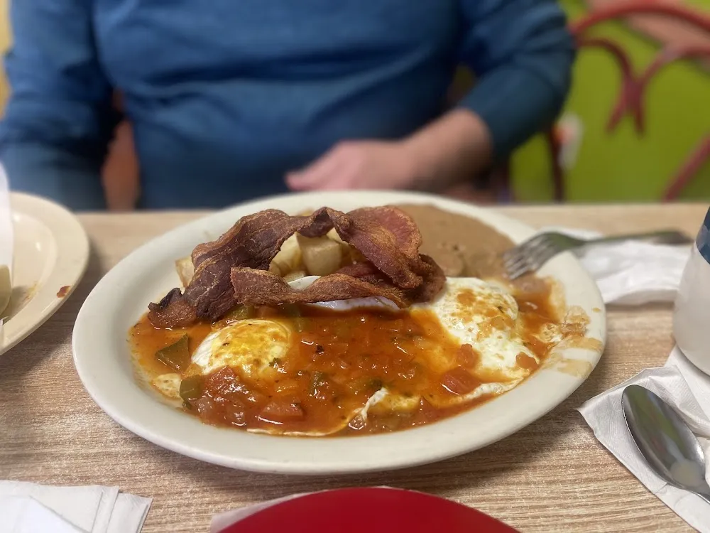 Huevos Rancheros Choice of Ham Bacon or Sausage